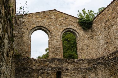 Ruins of Kvetera fortress city in the Georgian Caucasus mountain clipart