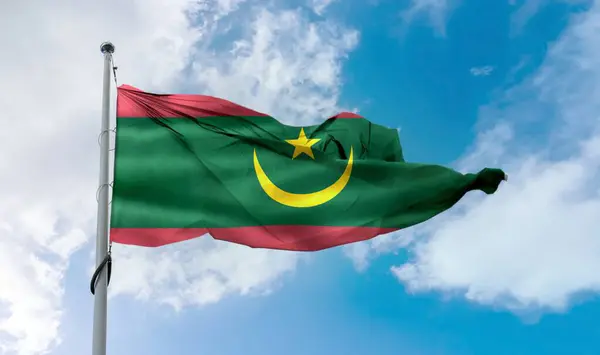 stock image Mauritania flag - realistic waving fabric flag in the sky