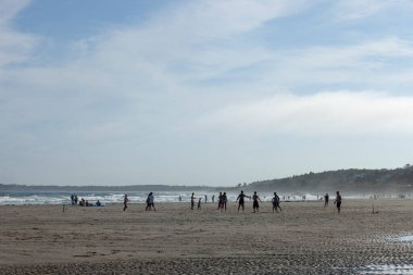 People enjoying the beach in Maine clipart