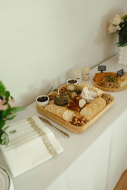 Vegan cheese and charcuterie board with crackers and nuts clipart