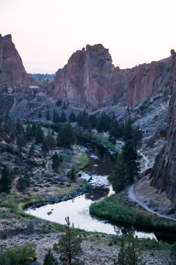 Towering rocks and a river winding through Smith Rock State Park. clipart