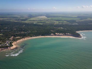 Beautiful aerial view to orange sandy cliffs and wild beaches clipart