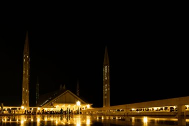 Night view of the facade of the Faisal mosque of in Islamabad clipart