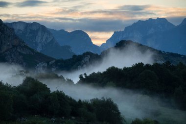 Misty mountain peaks from Mirador Echevarria Pedro Udaondo, Spain clipart