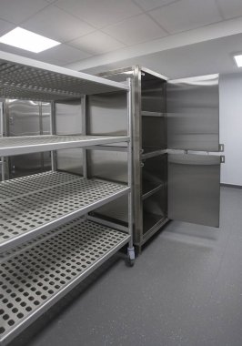 catering room with stainless steel storage and fridges clipart