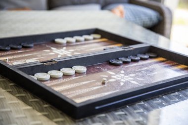 Traditional Backgammon game on the table clipart