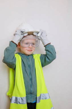 Child role-playing as a construction worker clipart