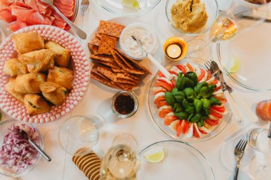 Festive Table with Appetizers and Drinks clipart