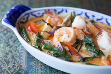 A fresh shrimp dish sits on a table at a Thai restaurant. clipart