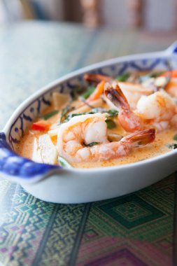 A fresh shrimp dish sits on a table at a Thai restaurant. clipart