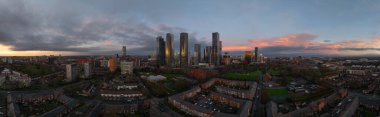 Mancheter cityscape at dusk with skyline features clipart