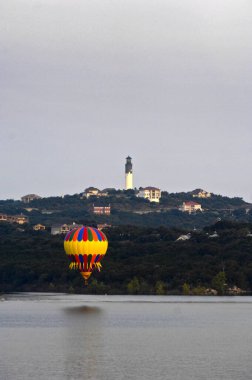 Hot air ballooning over Lake Travis in Austin, Texas. clipart