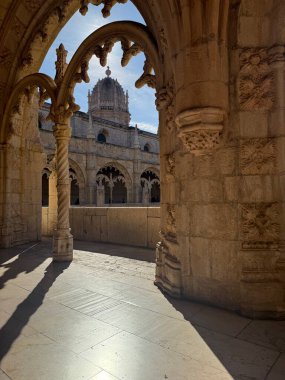 Mosteiro dos Jeronimos viewed through arch, Lisbon, Portugal clipart