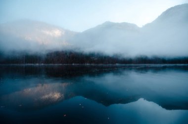 Morning winter fog over lake Konigsee in Berchtesgaden clipart