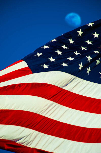 American flag against a blue sky.