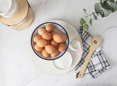 Overhead view of baking items on clean kitchen countertop
