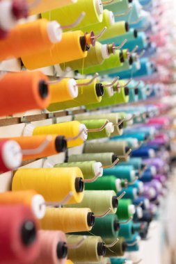 Rainbow wall of thread spools
