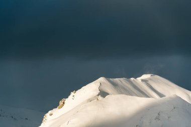 Pristine mountain ridges against deep blue sky