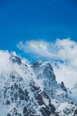 A Brocken spectre in the clouds in the Alps