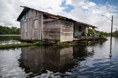 Beautiful view to local houses in flooded forest riverside community