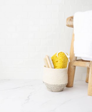 Vertical interior white shower scene with self care supplies