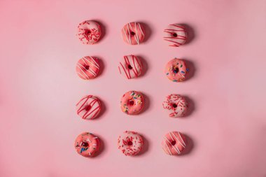 Flat-lay of Pink Donuts on Pink background