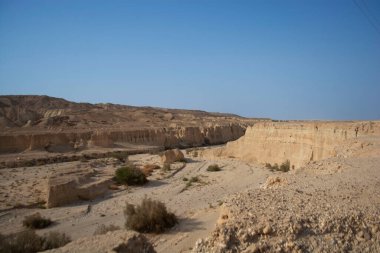 sandy and rocky desert landscape on a clear day
