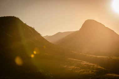 Golden Hour Splendor: Radiant Sunset Bathes Rolling Hills of Min