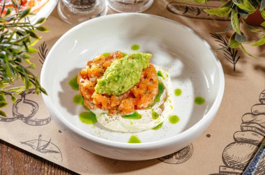 salmon tartare with avocado and cream sauce