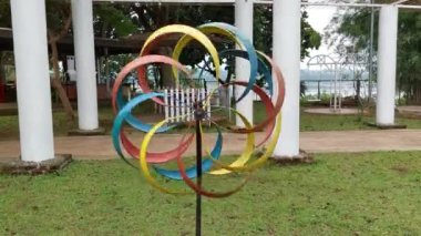 The colorful of propeller at the backyard of cafe. Beautiful motion with wind from the lake.