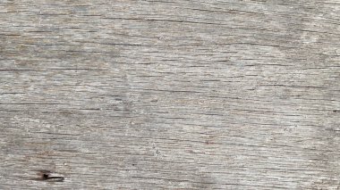 Görünür tahıl ve yıpranmış doku ile eski ahşap bir yüzey ayrıntılı görünümü.
