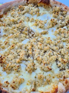 evocative close-up image of a mozzarella-based white pizza without tomatoes