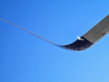 evocative image of the final part of the wing of an airliner