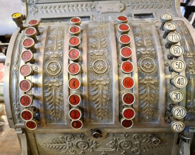 evocative close-up image of old retail cash register