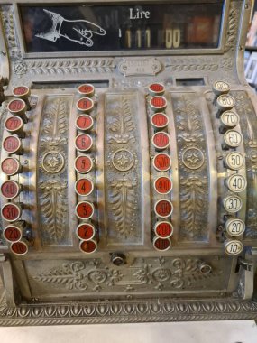 evocative close-up image of old retail cash register