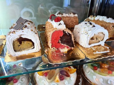evocative image of typical Sicilian pastry cakes and ice creamsin an ice cream shop window