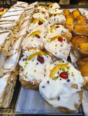evocative image of typical Sicilian pastry cakes and ice creamsin an ice cream shop window