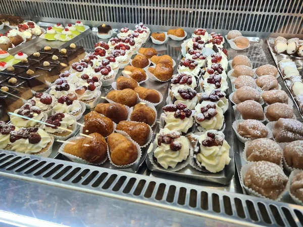 stock image evocative image of typical Sicilian pastry cakes and ice creamsin an ice cream shop window