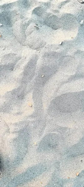 İtalya 'da bir kumsalın kum taneciklerinin anımsatıcı görüntü dokusu