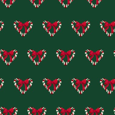 Noel kartı, şenlikli ambalaj kağıdı, mevsimlik reklamlar, parti davetiyeleri ve ambalaj tasarımları için mükemmel bir kalp şeklinde hazırlanmış kırmızı yaylı ve şeker kamışlı Noel şekeri..