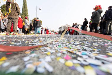 Festive Mess: Camera Captures Coriander Confetti Blanketing Carnival Streets