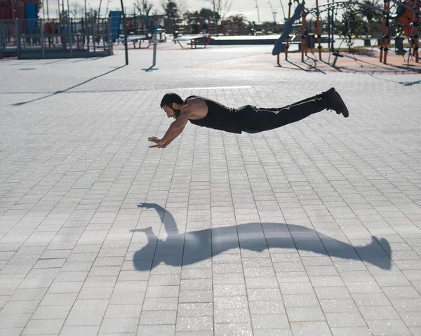 Man Black Sportswear Jumps Doing Push Ups Park — Stock Photo, Image