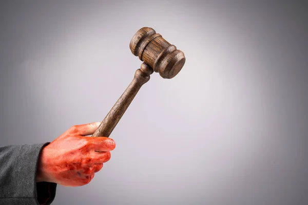 Female Judge Holds Gavel Bloody Hand White Background Copy Space — Stock Photo, Image