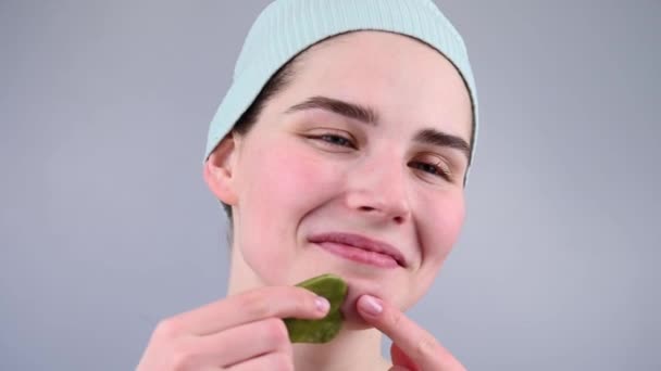 Close Portrait Young Woman Massaging Her Face Gouache Scraper — Stock Video