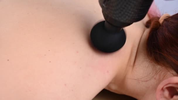 Doctor Massaging Back Female Patient Percussion Massager Gun — Stock Video