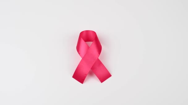 Woman Holding Pink Ribbon White Background Symbol Fight Breast Cancer — Stock Video