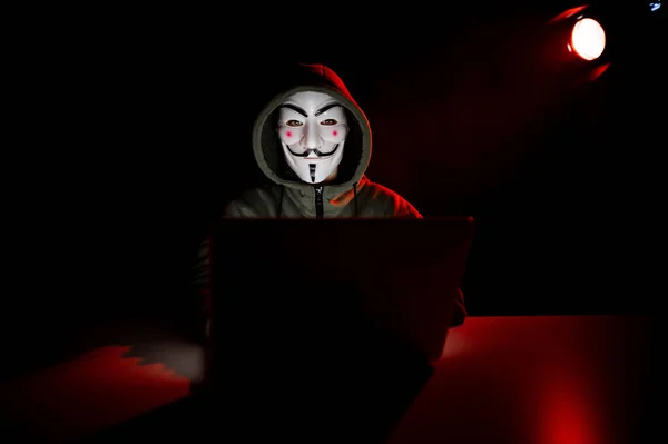 June 2022 Novosibirsk Russia Anonymous Hood Typing Laptop Dark Red — Stock Photo, Image