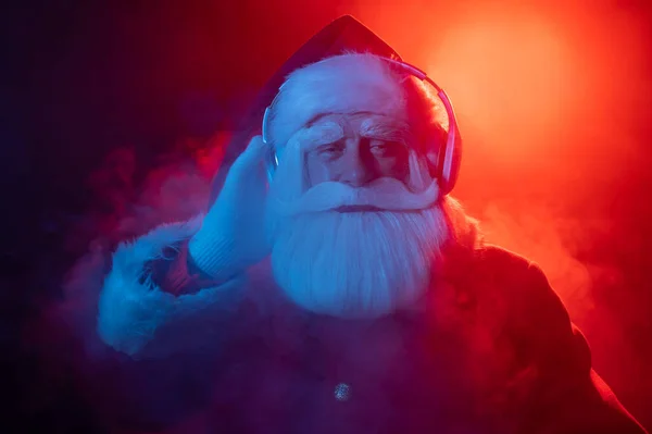 Santa Claus Listens Music Headphones Party Blue Red Neon Light — Stock Photo, Image