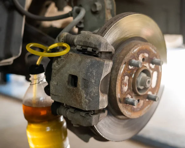 Automatic change of brake fluid in a car service