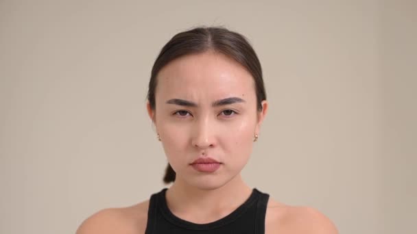 Portrait Grimacing Smiling Asian Woman White Background — Stockvideo
